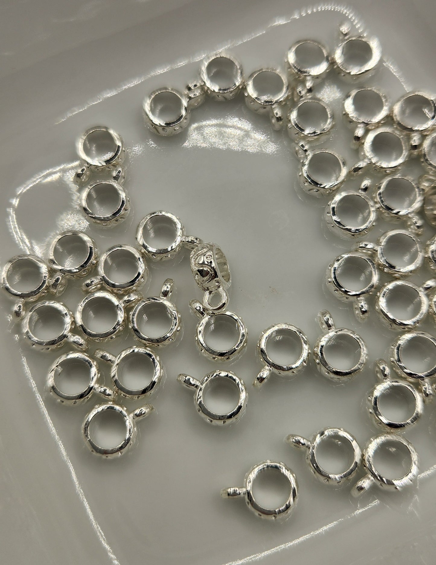 Bail spacers with charm *Individually sold